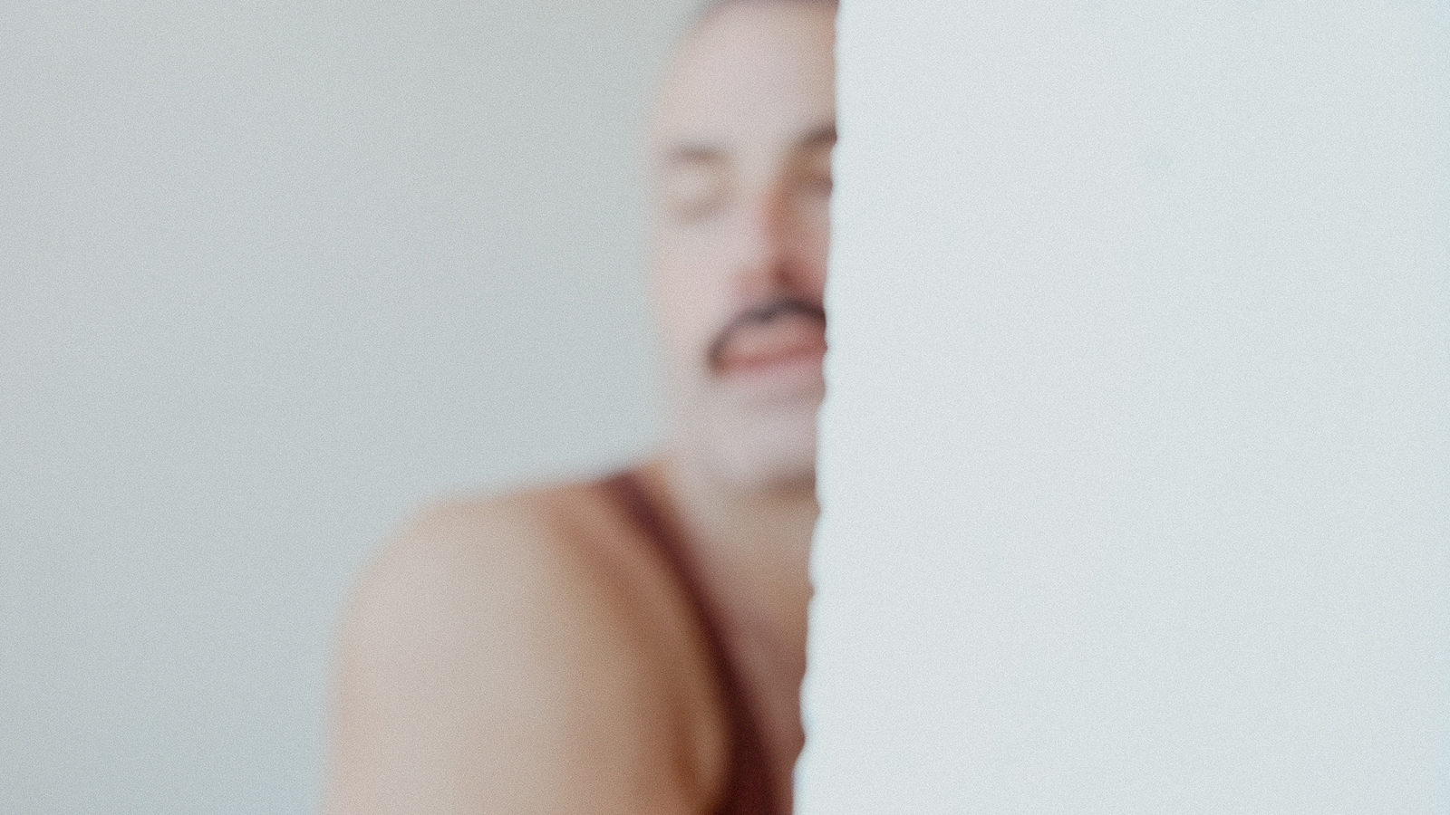 figure behind a wall