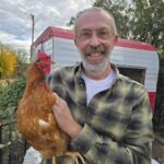 Photograph of Tom McGovern holding his chicken.